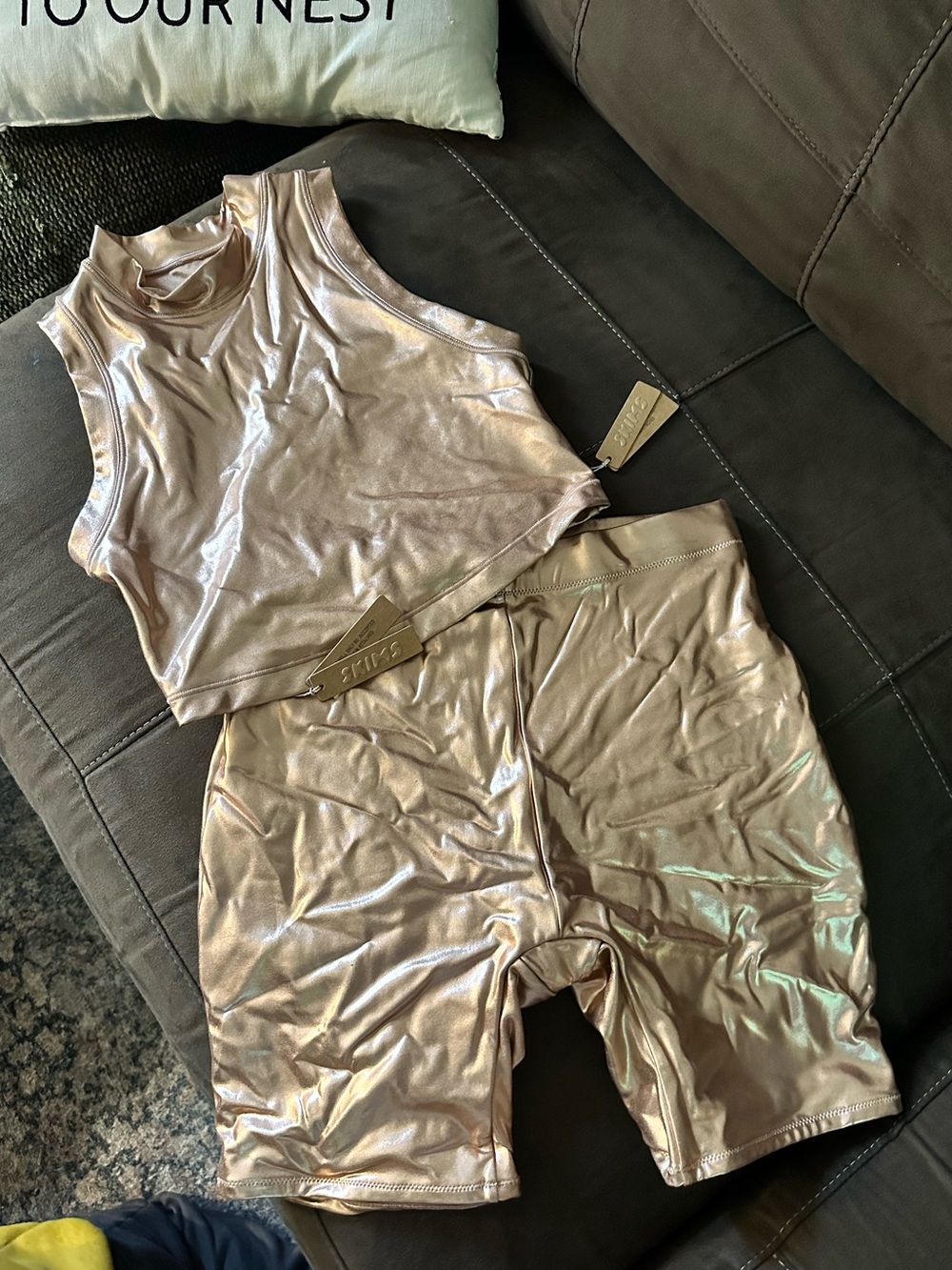 SKIMS Metallic Bronze Swim Crop Top and biker shorts